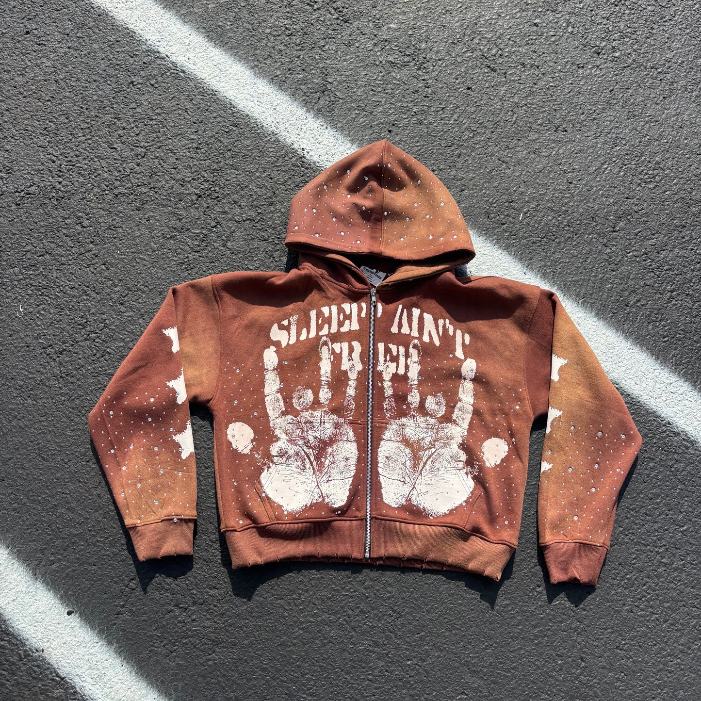 Brown handprint zip